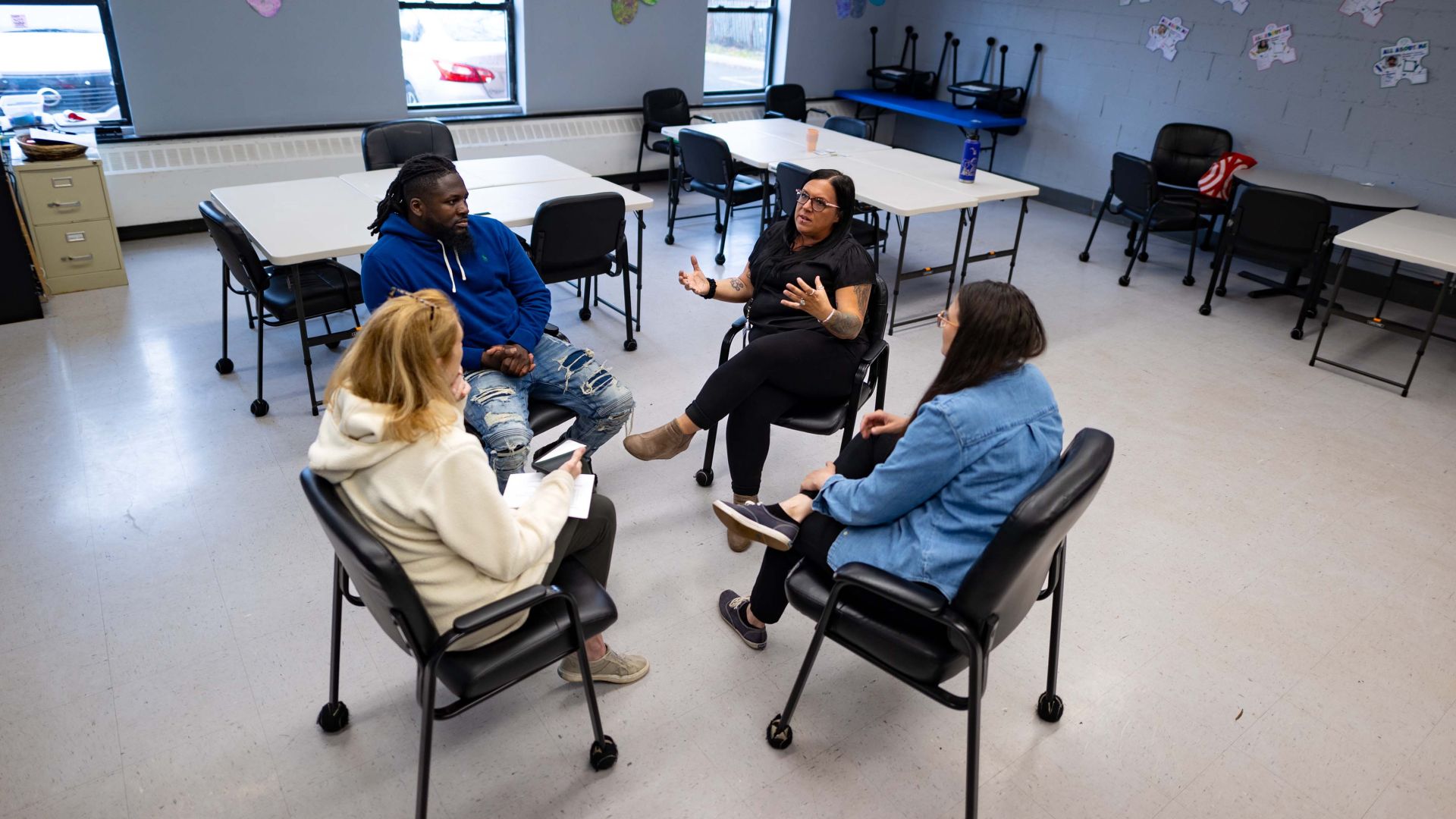 Classroom with 4 people talking